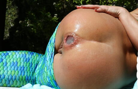 Attractive american babe Adriana Chechik in strange fetish gallery near the pool