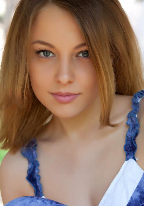 Very attractive youthful Nikia A uncovering small tits and spreading her legs outdoor